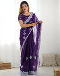 Pastel purple shimmer chiffon saree with intricate sequin embroidery and scalloped border details