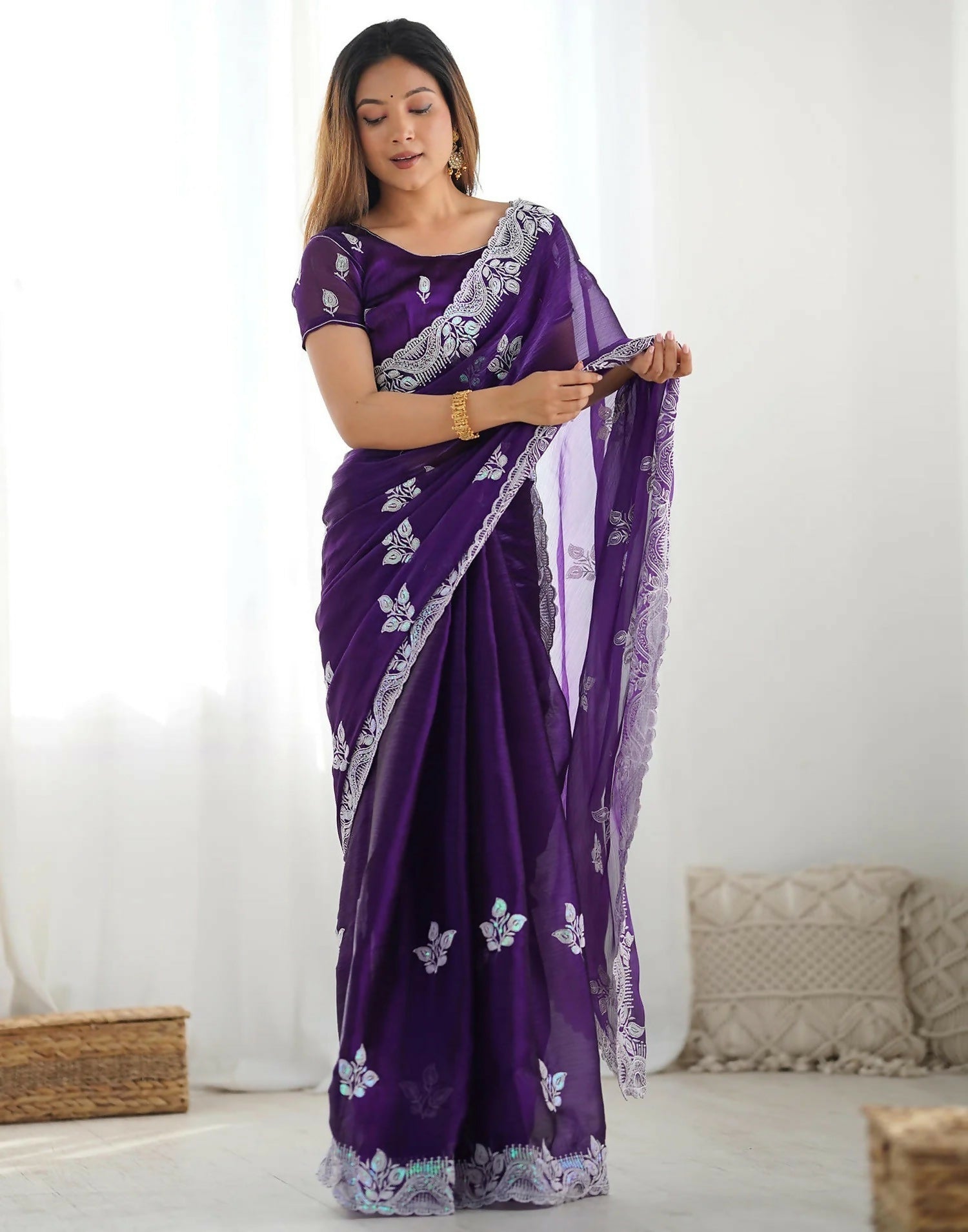Pastel purple shimmer chiffon saree with intricate sequin embroidery and scalloped border details