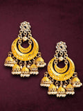 Young girl wearing traditional silver Meenakari Kundan Jhumka earrings for festive occasions