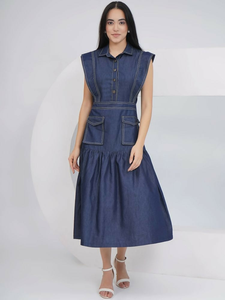 A modern sleeveless blue denim midi dress with a collared neckline and contrast white stitching, displayed in a casual A-line silhouette.