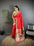 Red soft silk Kanchipuram saree with woven peacock and floral patterns.