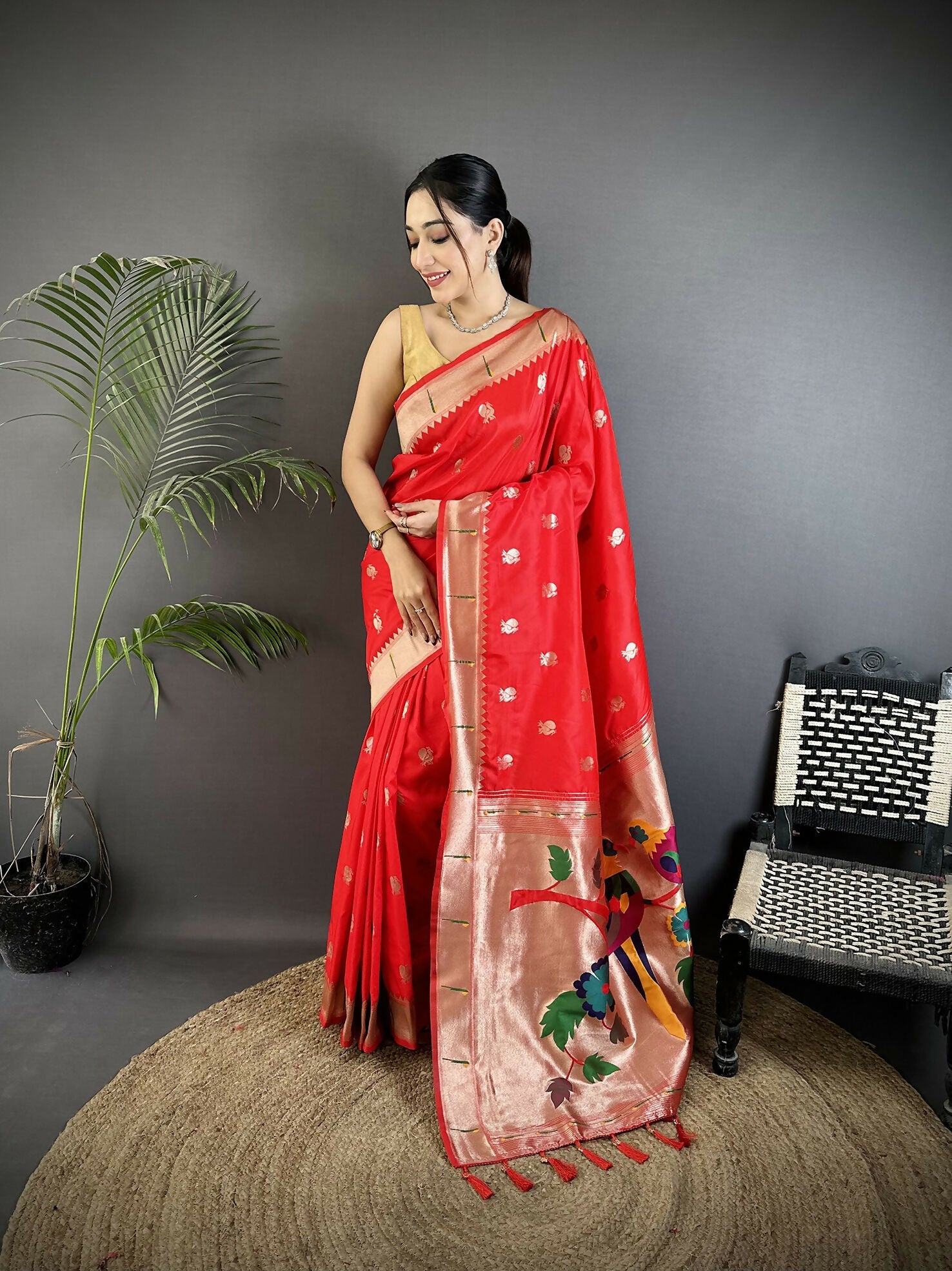 Red soft silk Kanchipuram saree with woven peacock and floral patterns.