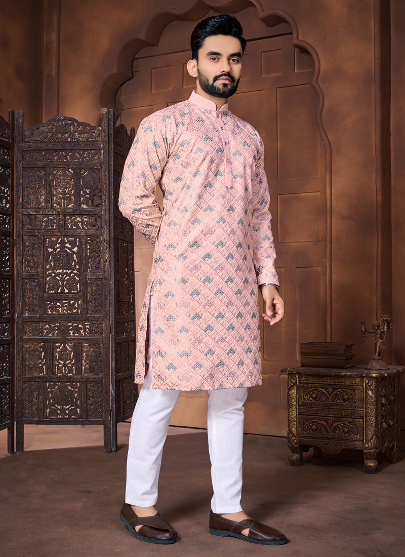 Baby boy wearing a soft pink Italian silk kurta with floral-inspired embroidery.