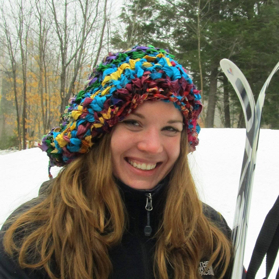 Vibrant, multi-colored slouchy knit beanie pattern shown in a bohemian, eclectic lifestyle setting.
