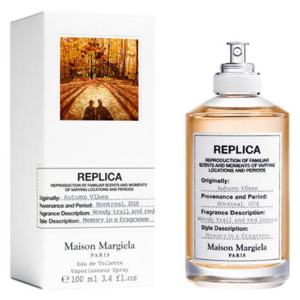 Maison Margiela REPLICA Autumn Vibes fragrance bottle with amber liquid and minimalist label.
