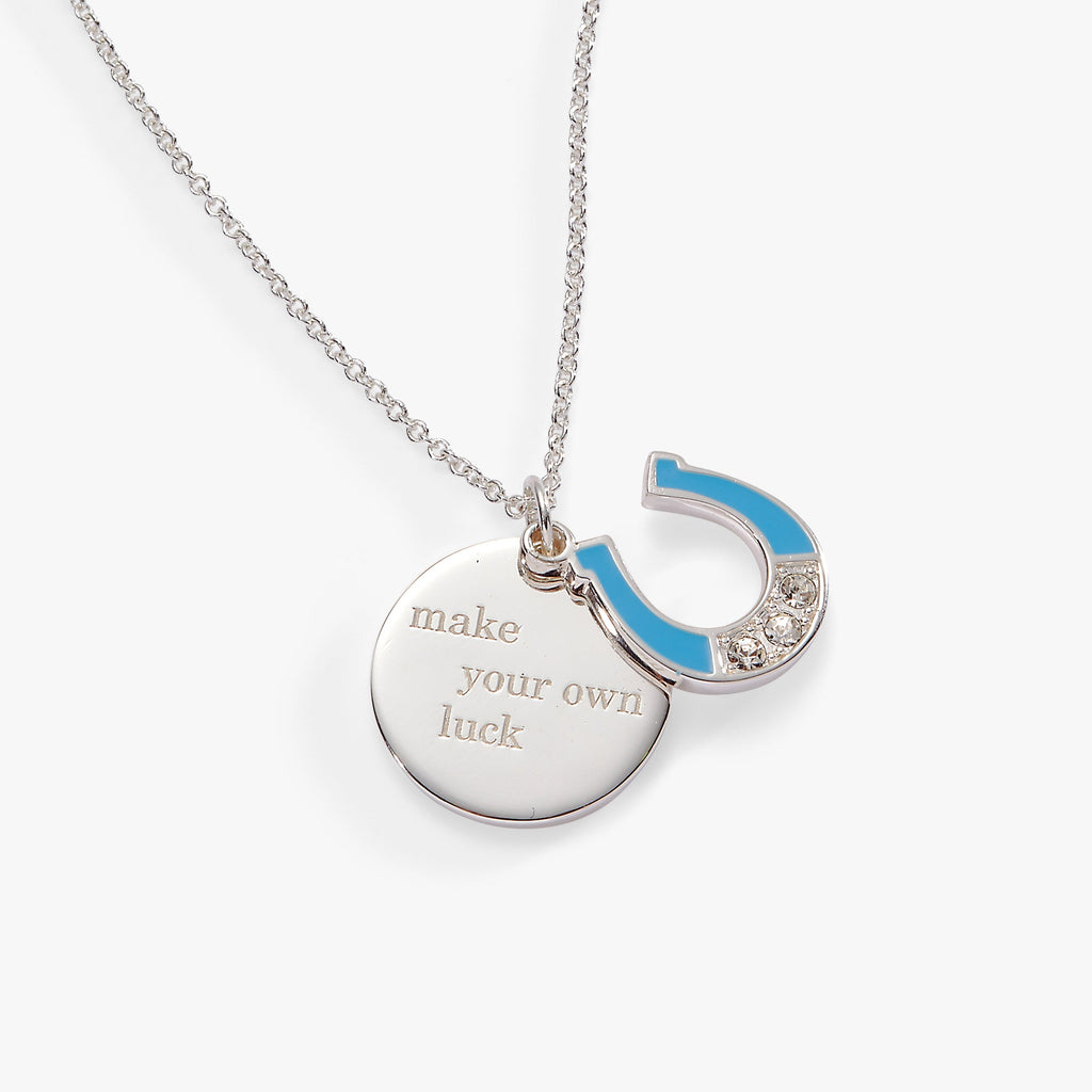 Duo charm pendant necklace featuring an engraved circular charm and a crystal-set lightning bolt.