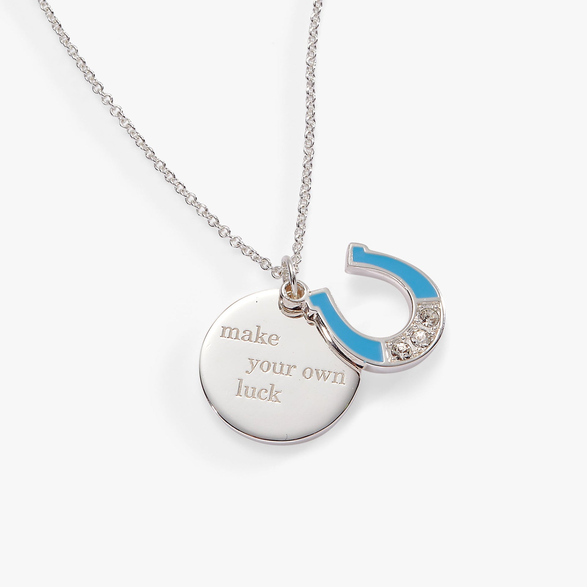 Duo charm pendant necklace featuring an engraved circular charm and a crystal-set lightning bolt.