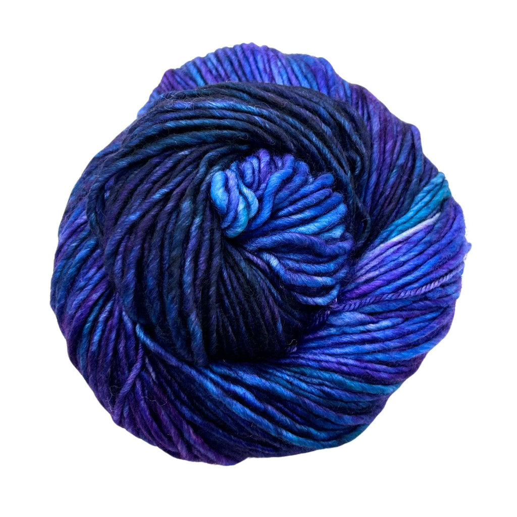 Close-up of hand-dyed variegated blue, violet, and green superwash merino wool yarn