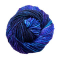 Close-up of hand-dyed variegated blue, violet, and green superwash merino wool yarn