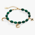 Charm bracelet featuring malachite stone, yin-yang symbol, and moon charm