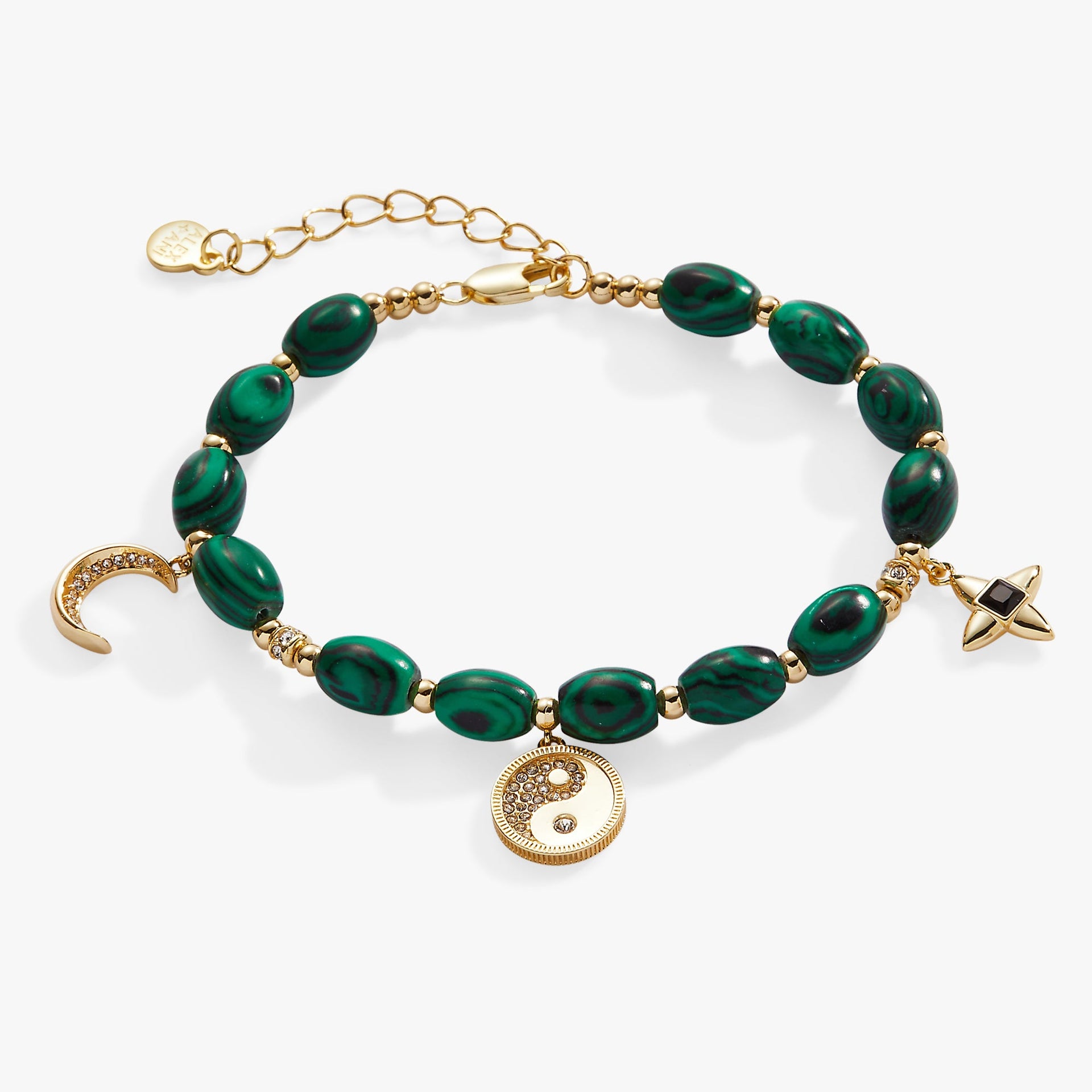 Charm bracelet featuring malachite stone, yin-yang symbol, and moon charm