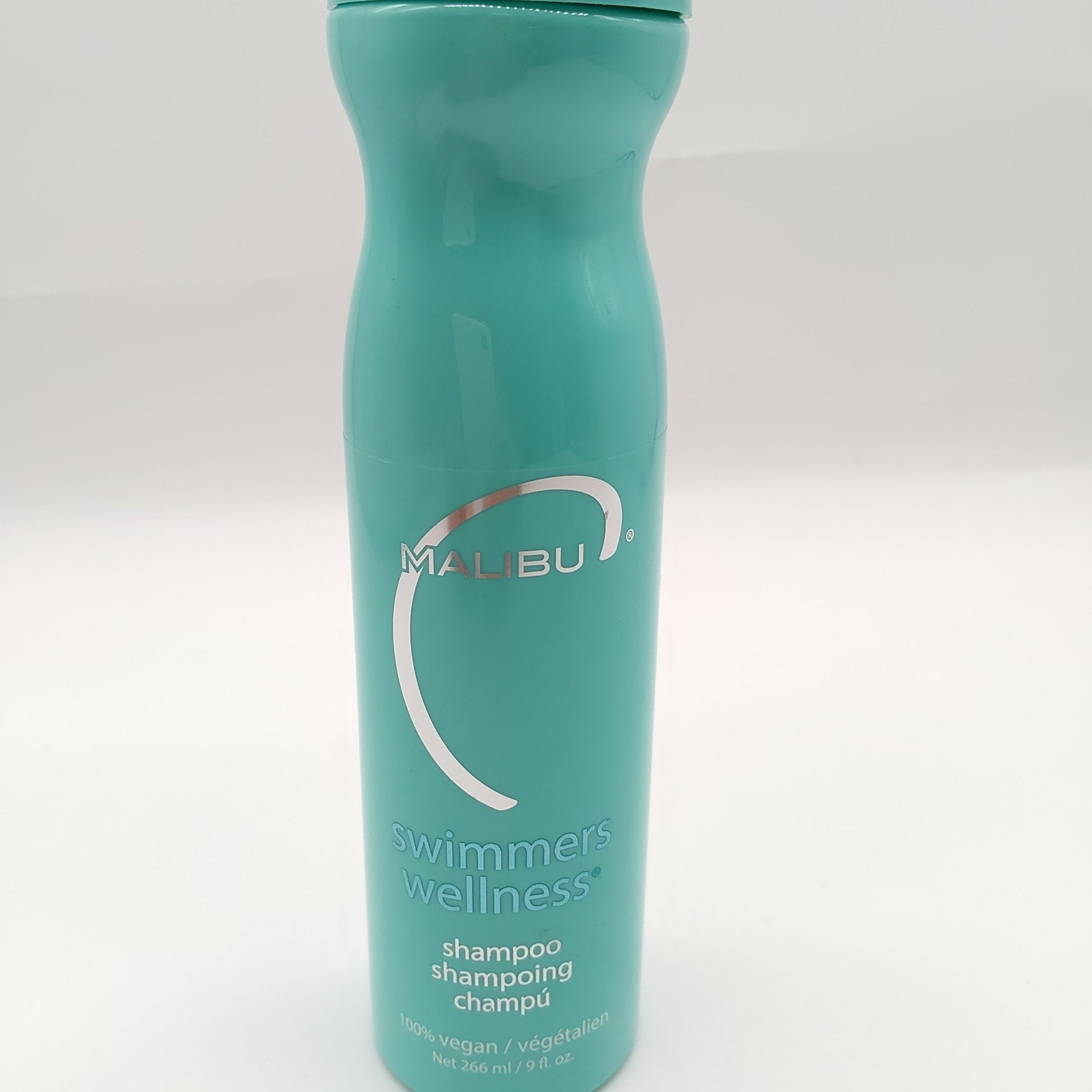 Teal bottle of Malibu C Swimmers Wellness Shine Enhancing Shampoo