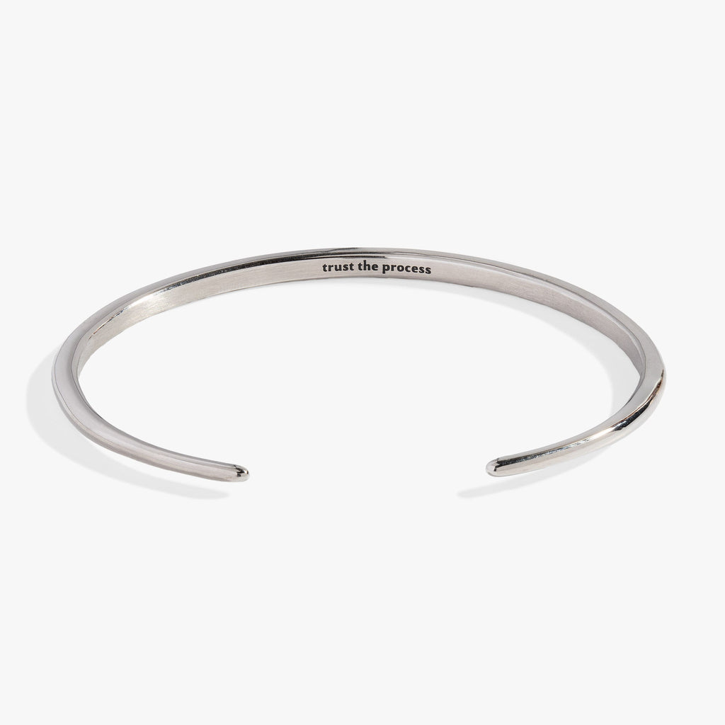 Silver-tone stainless steel open cuff bracelet with crystal-encrusted tusk ends