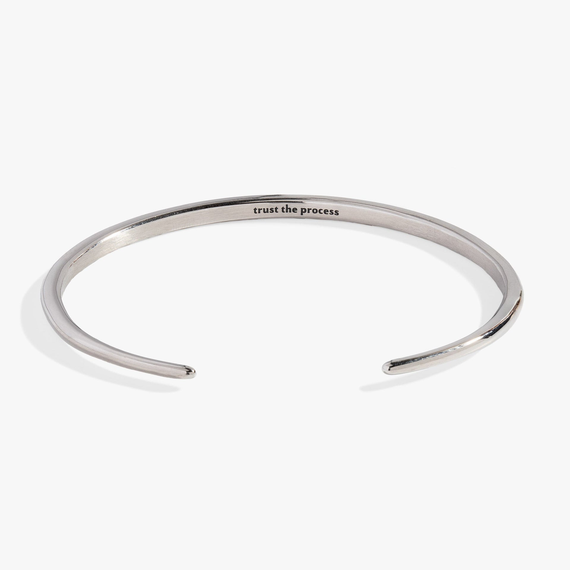 Silver-tone stainless steel open cuff bracelet with crystal-encrusted tusk ends