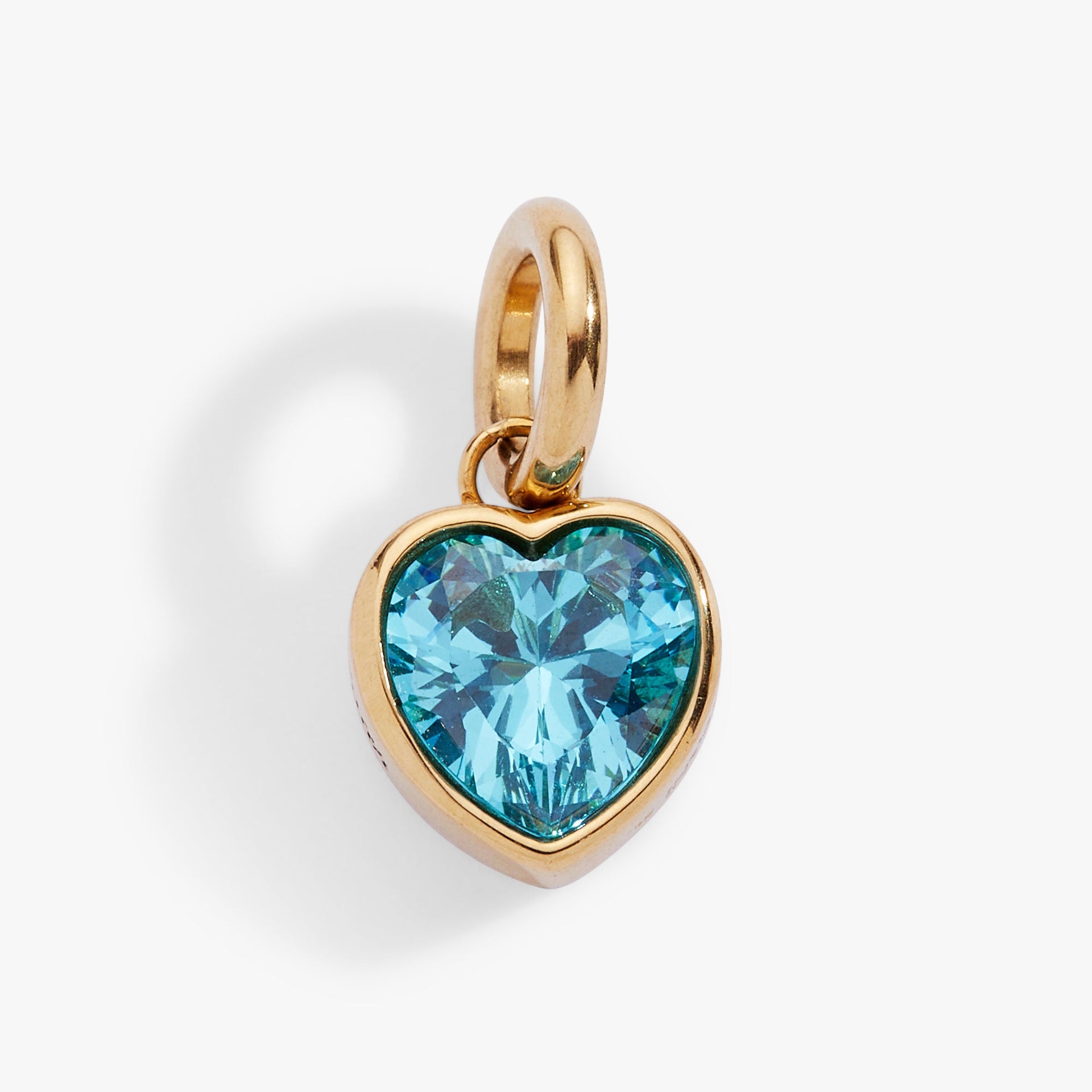 March birthstone heart charm in polished gold tone with a faceted aquamarine blue crystal