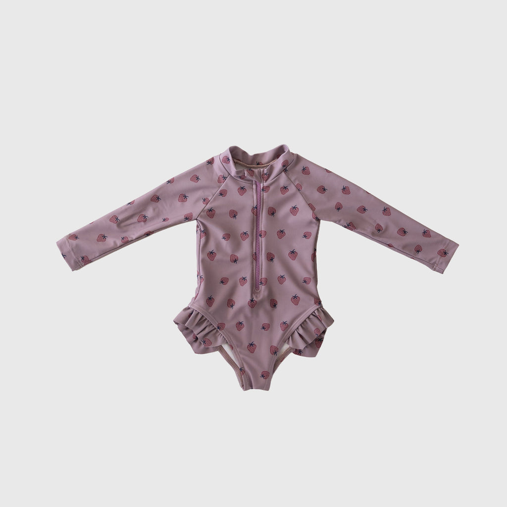 Girl's long sleeve one-piece swimsuit in dusty-purple or pink with front zipper and ruffle legs