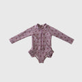Girl's long sleeve one-piece swimsuit in dusty-purple or pink with front zipper and ruffle legs