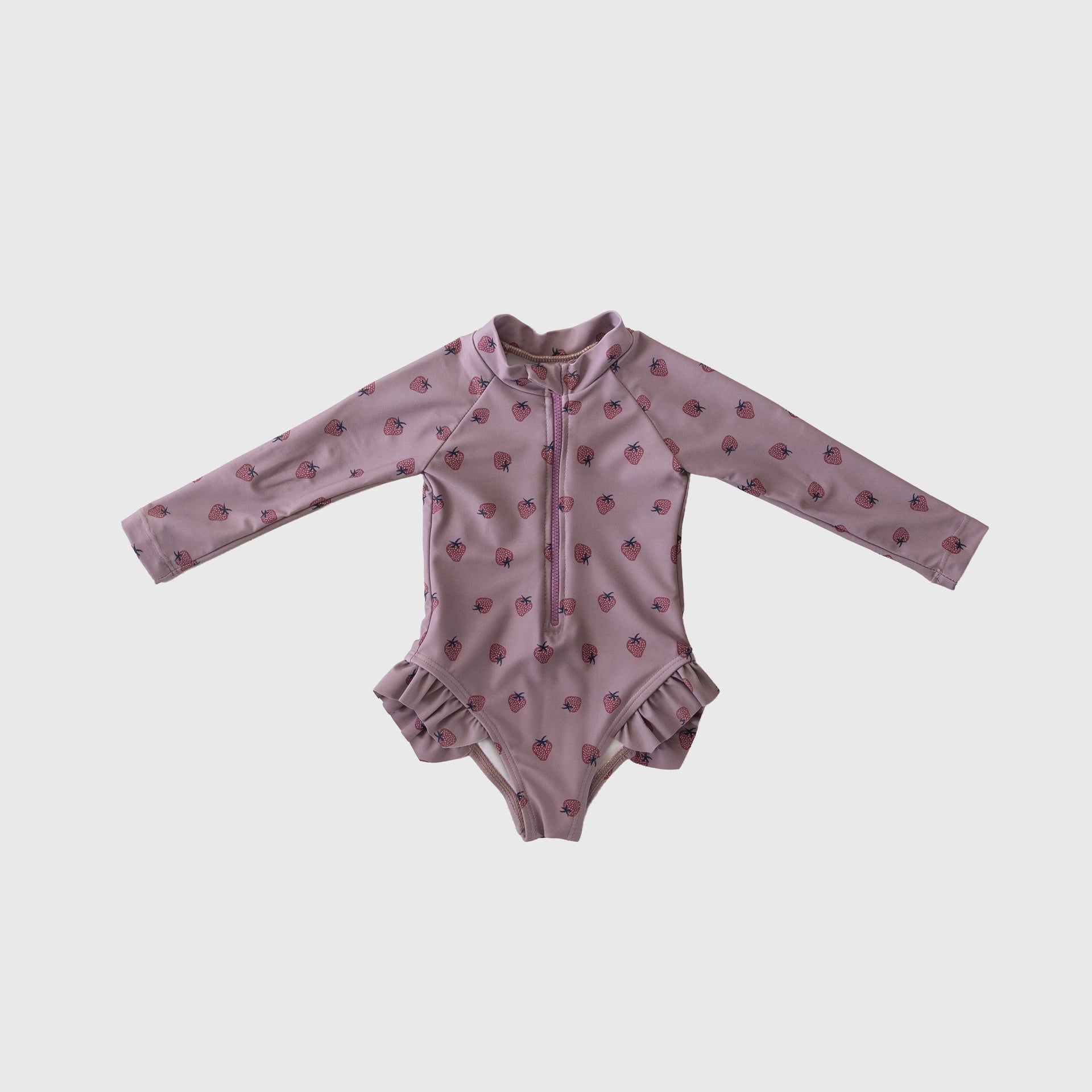 Girl's long sleeve one-piece swimsuit in dusty-purple or pink with front zipper and ruffle legs