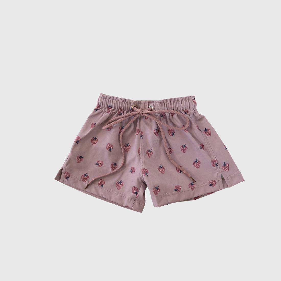 Matilda print board shorts with pink strawberries on a dusty purple background for infants and children
