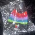 Matrix black and striped pom beanie hat featuring a knit pattern and top pom detail