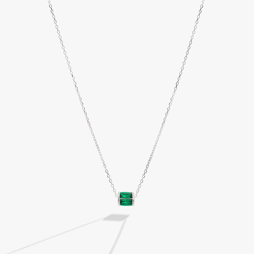 May birthstone pendant necklace featuring emerald-toned baguette crystals on a delicate chain