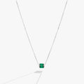 May birthstone pendant necklace featuring emerald-toned baguette crystals on a delicate chain