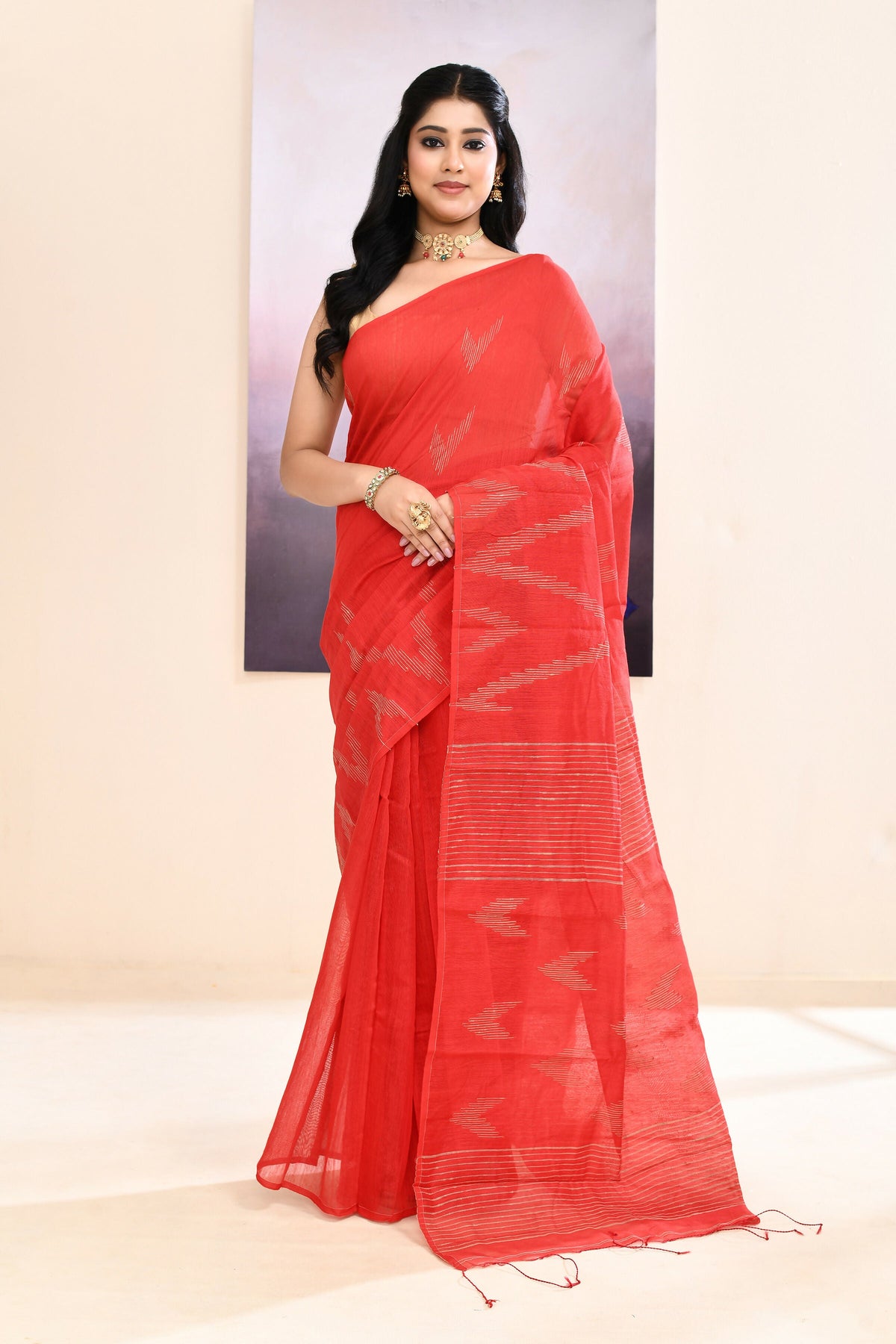 Red cotton blend Jamdani saree with beautiful embellishments