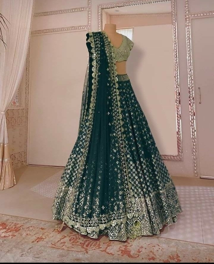Bottle green faux georgette lehenga with mirror and zari detailing