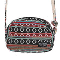 A medium-sized woven pattern crossbody bag with a black base and vibrant multi-colored geometric accents, featuring an exterior zipper pocket.