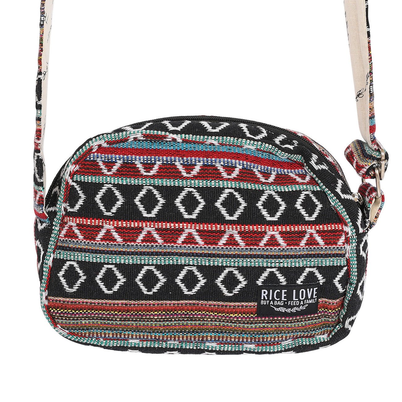 A medium-sized woven pattern crossbody bag with a black base and vibrant multi-colored geometric accents, featuring an exterior zipper pocket.