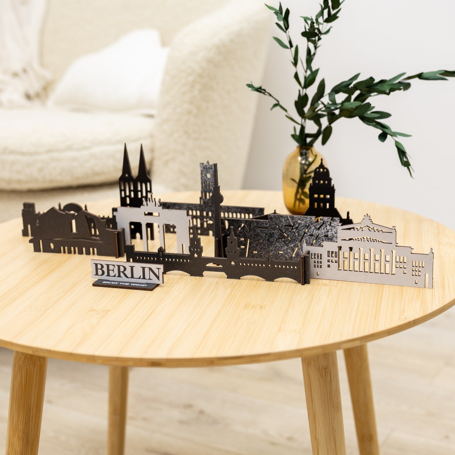 Detailed wooden model of the Berlin city skyline featuring iconic architectural landmarks