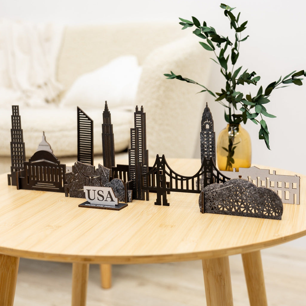 Laser-cut wooden art piece featuring iconic USA building silhouettes