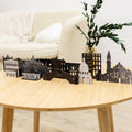A detailed wooden sculpture of the Venice city skyline, displayed as a decorative travel souvenir.