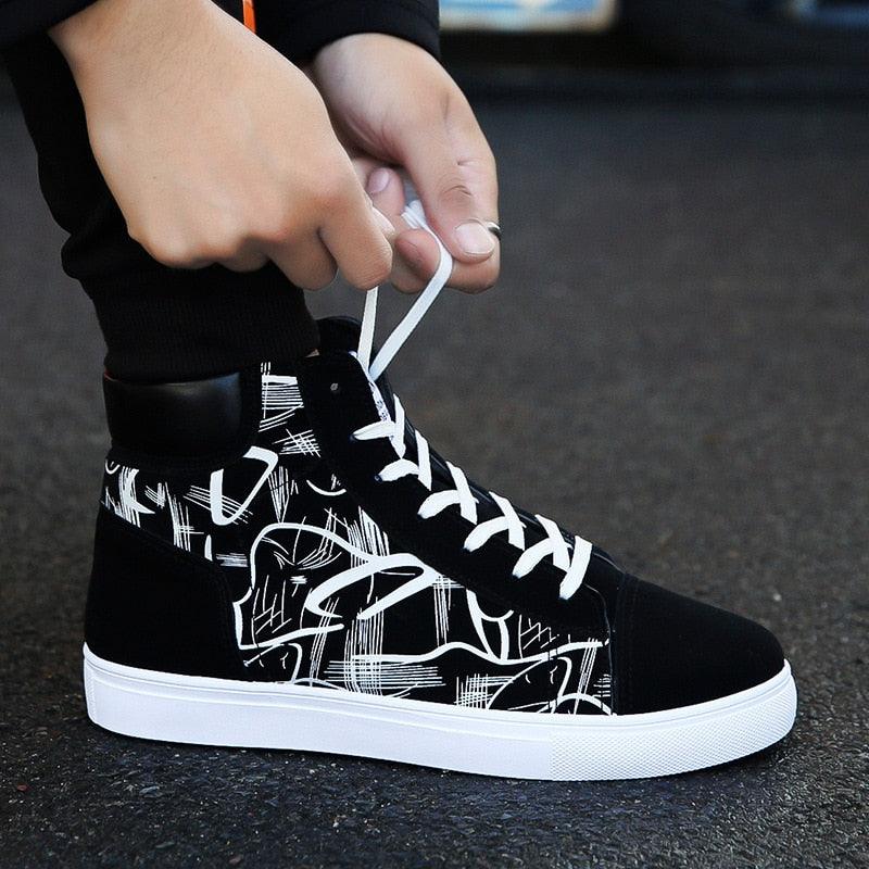 A pair of breathable black, blue, and red canvas casual sneakers for kids displayed on a white background.