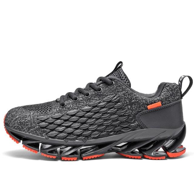 Unisex black knit running sneakers with orange sole accents and pull-on design