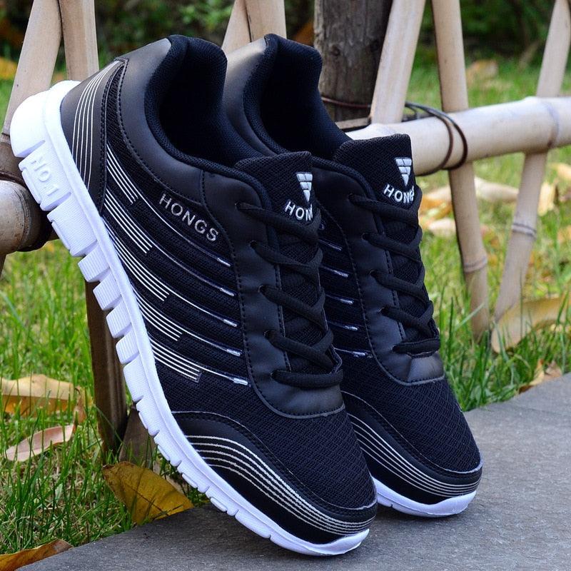 HONGS Men's lightweight breathable knit walking sneakers in black and white