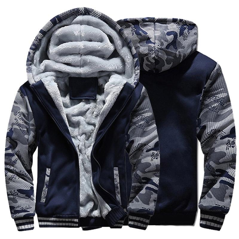 Men wearing a camouflage zip-up winter hoodie jacket in navy and grey against a neutral background.