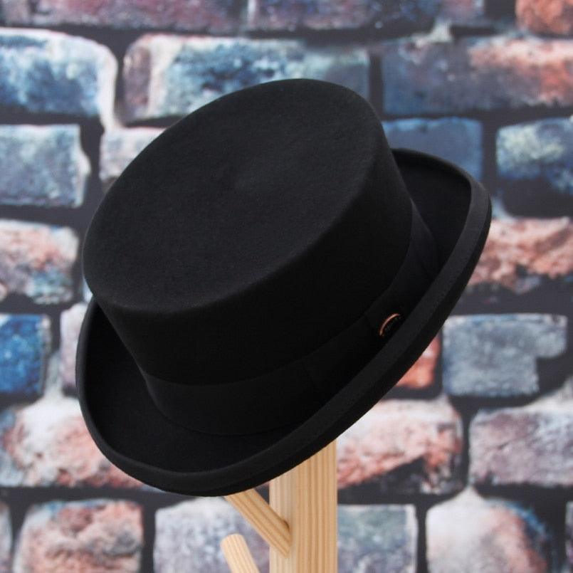 Classic black wool pork pie hat with flat top design and breathable structure