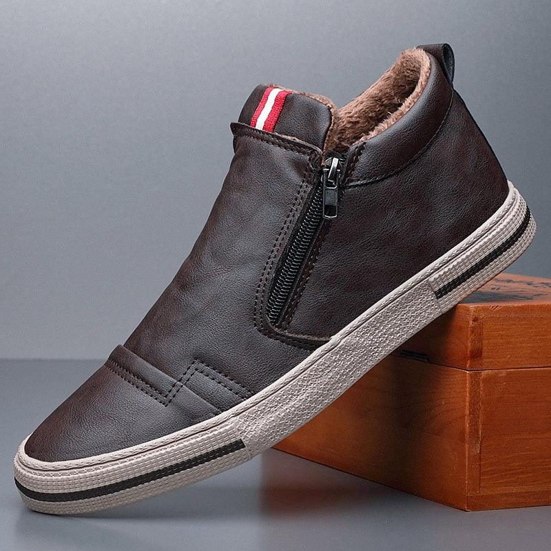 A pair of black faux leather men's winter snow boots with plush lining and anti-slip soles.