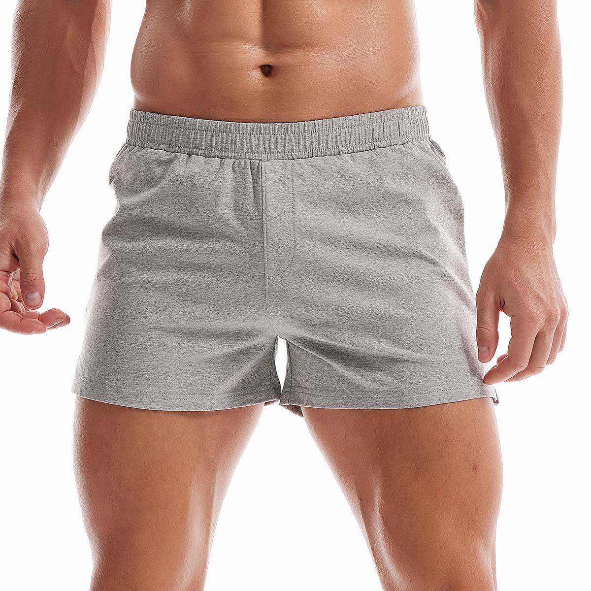 Men's minimalist cotton lounge shorts in grey, navy, and black with an elastic waistband.