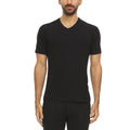 Men wearing a solid black microweight merino wool v-neck t-shirt with raglan sleeve detailing.