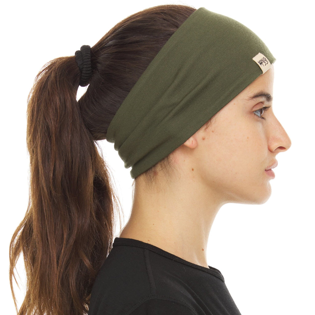 A close-up of a reversible midweight merino wool headband in olive green, showing the high-quality knit texture.