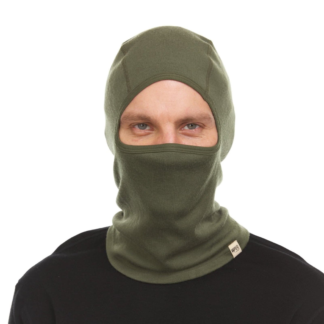 Unisex heavyweight merino wool balaclava in solid black, olive, and navy knit fabric.