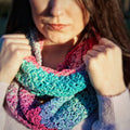 Mermaid Vibes Infinity Scarf Crochet Kit featuring lace weight silk yarn skeins and crochet tools.