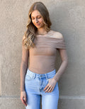 Model wearing a long-sleeve taupe off the shoulder mesh bodysuit with a form-fitting silhouette.