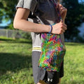 Colorful rainbow mesh tote bag with a bohemian style design