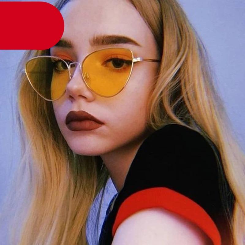 Stylish metal round cat eye sunglasses in gold and black finishes.