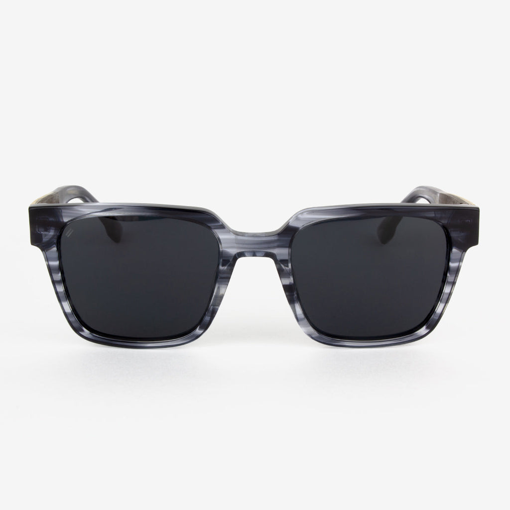 Micanopy sunglasses featuring a stylish boxy acetate frame and wood detailing.