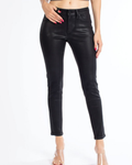 Model wearing mid rise black coated denim super skinny jeans with a zip-fly and tapered silhouette.