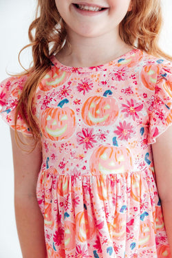 Toddler wearing a Spooktacular flutter sleeve twirl dress with a full skirt
